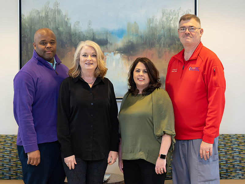 Among leaders of the online MSN program at UMMC's School of Nursing are, from left, Dr. Derek Holt, assistant professor of nursing and director of the family nurse practitioner track, Dr. Jeanne Calcote, assistant professor of nursing and director of the nursing and health care administrator tracks, Dr. Kim Douglas, associate professor of nursing and director of the nurse educator track, and Dr. Carl Mangum, associate professor of nursing and director of the psychiatric/mental health nurse practitioner tracks.